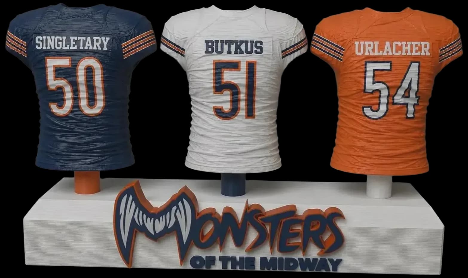Three football jerseys with player names mounted together on a custom team nameplate base